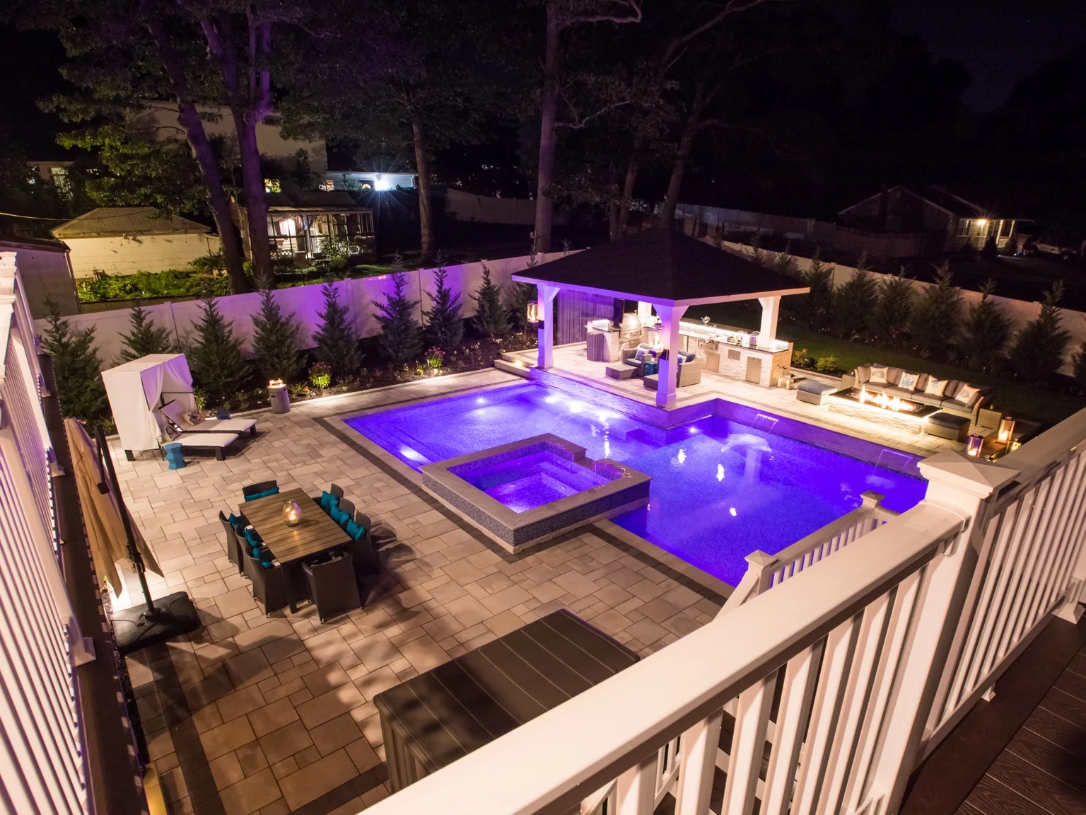 Elevated nighttime view of completed Brookhaven pool spa pavilion and patio