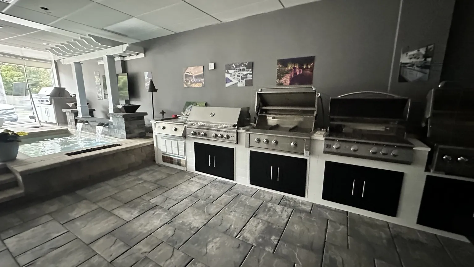 Outdoor grills and outdoor kitchen appliances displayed in the L.I. Backyard Store showroom