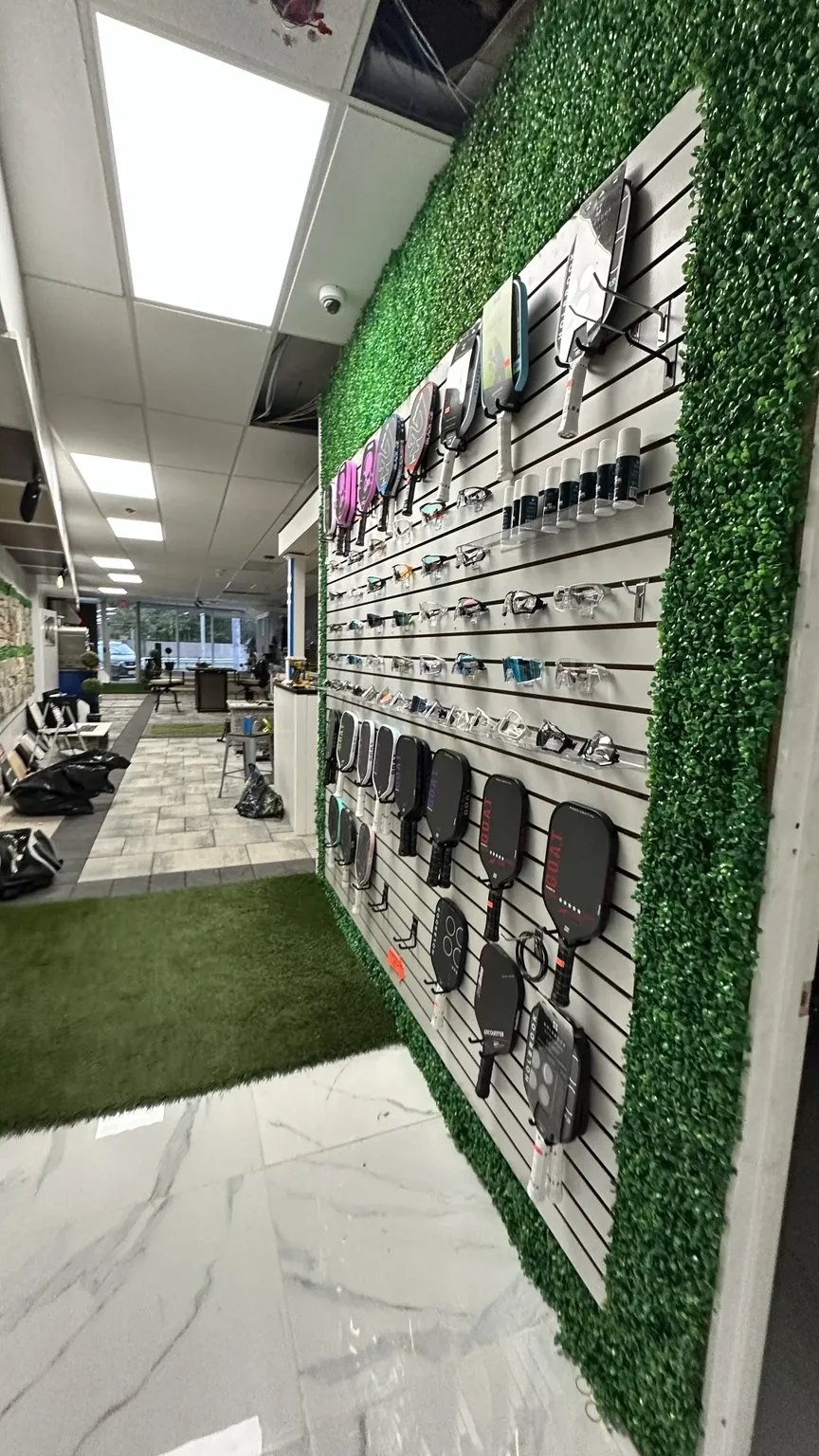 Pickleball paddles and accessories displayed at the Melville showroom
