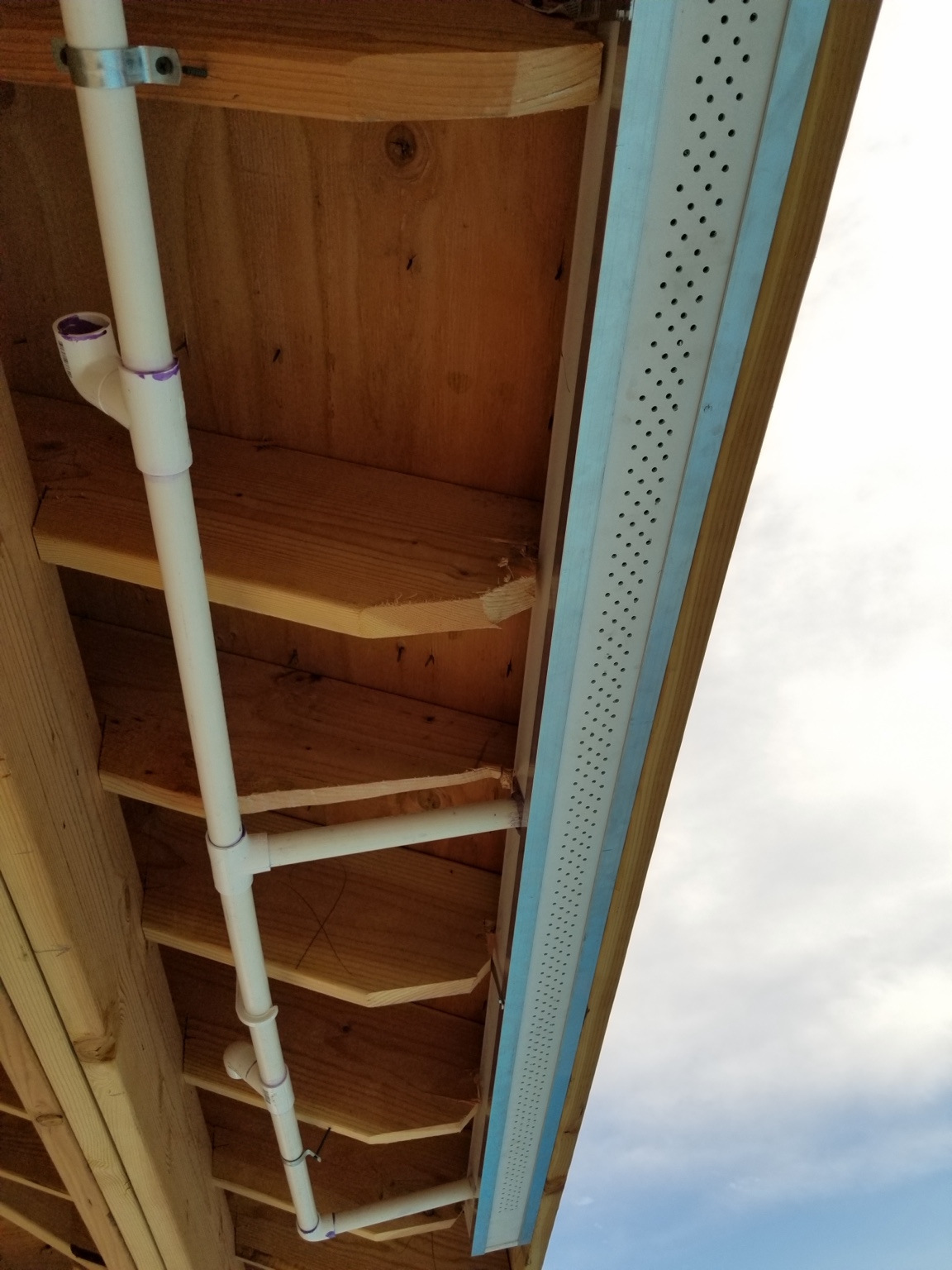 PVC plumbing integrated into pavilion rain curtain