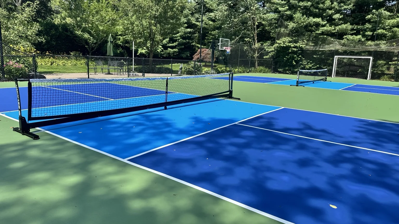 Three finished pickleball courts in Melville New York
