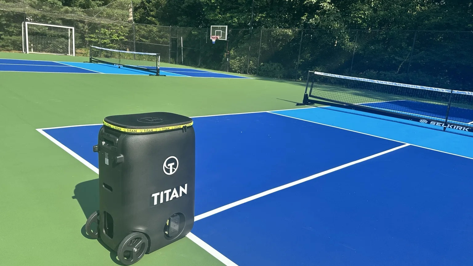 Titan ball machine on finished Melville pickleball courts