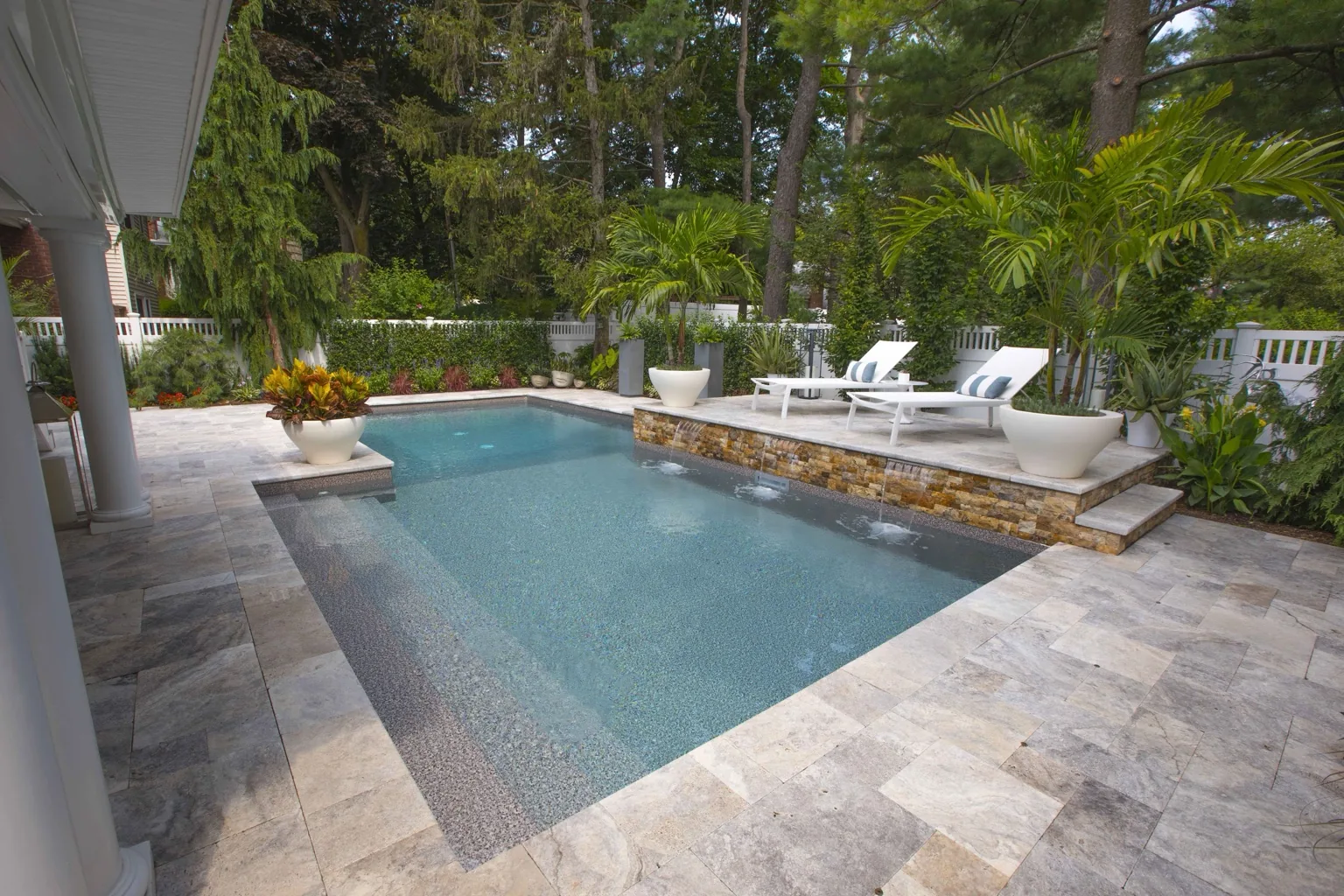 Covered living area beside pool