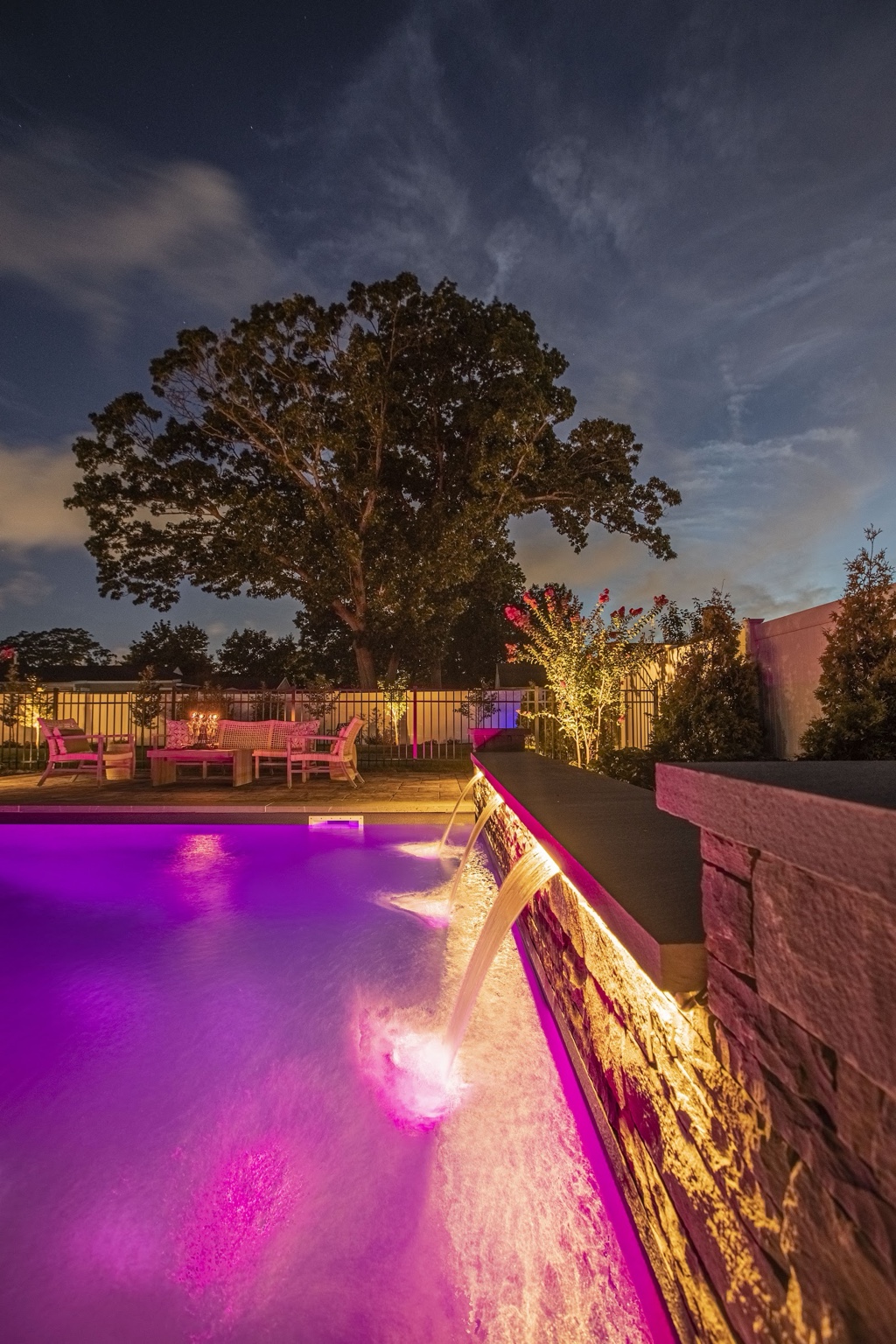 Finished pool and water feature at night
