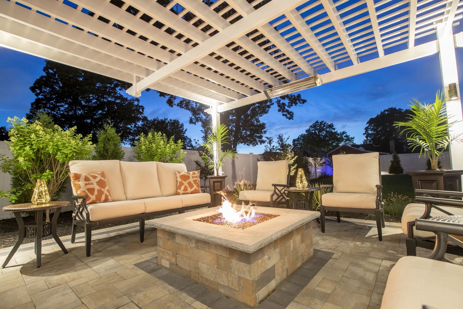 Finished outdoor living area beneath pergola