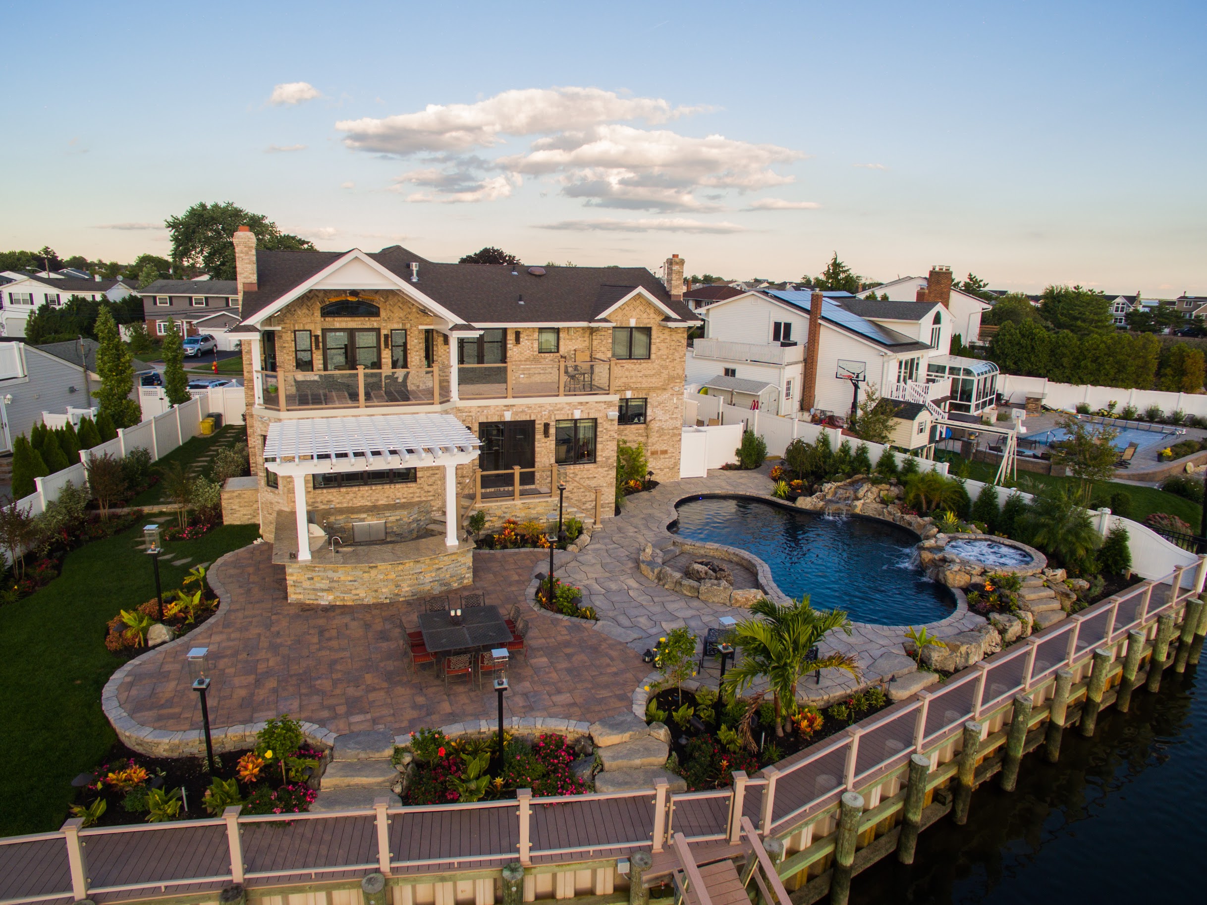 Waterfront backyard with pool and outdoor living